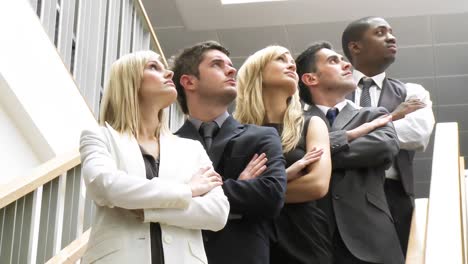 Business-people-on-stairs-looking-upwards-footage