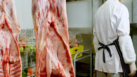 butcher checking meat in butchers shop 4k