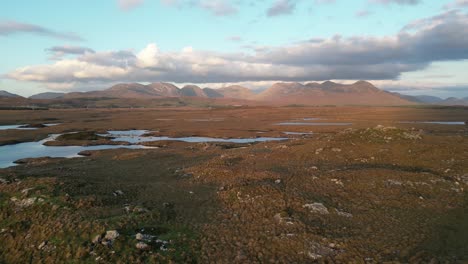 Ascending-aerial-of-Connemara,-a-region-of-immense-natural-beauty-in-Ireland,-renowned-for-its-abundance-of-rushing-rivers,-tranquil-lakes