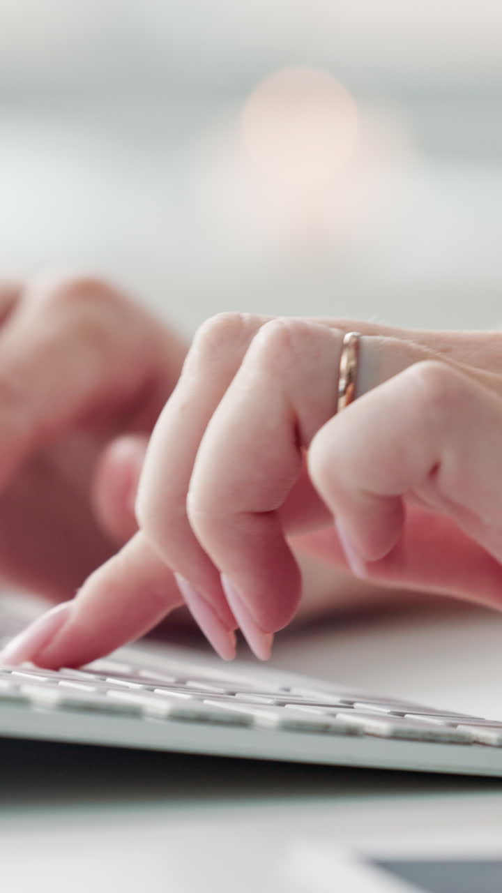 Close-up of Female Hands Typing on a Computer Keyboard