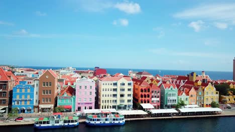 tilt down aerial view of the skyline of the punda district in willemstad, dutch caribbean island