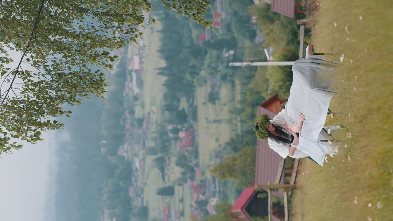 Therapist female doctor making woman relaxing spa face massage outdoors in mountains field fantasy