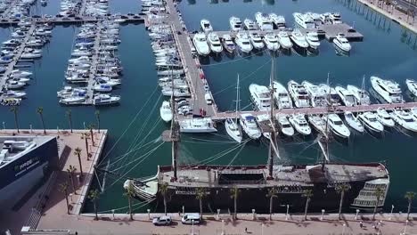 aerial view of a busy marina with yachts and boats