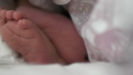 close up of baby feet moving