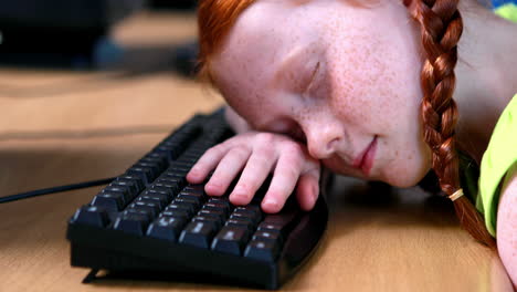 little girl sleeping on keyboard