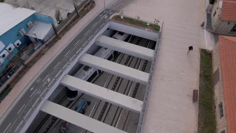 Aerial-drone-view-of-metro-arriving-at-Elifelet-subway-station-in-Tel-Aviv