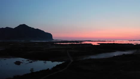 Aerial-shot-of-Lofoten-countryside-in-Norway-during-blue-hour-sunset