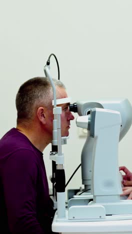 optometrist optician doctor examines patient