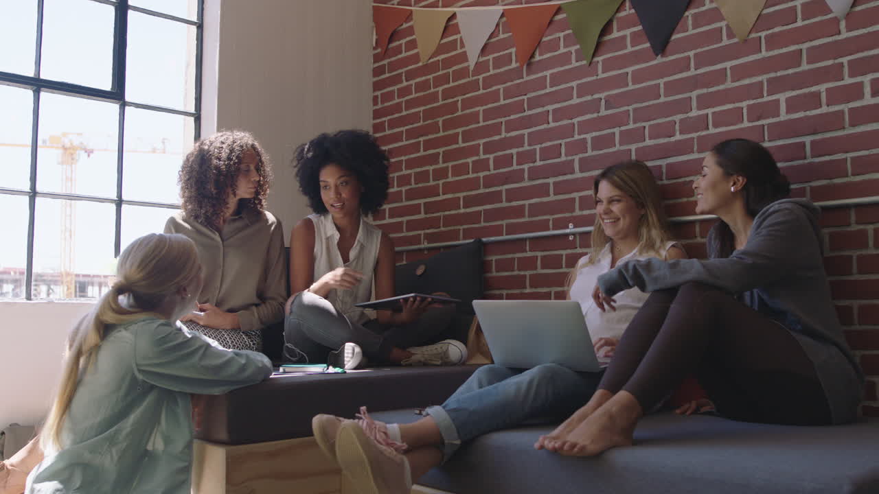 multi ethnic business women brainstorming sharing ideas creative team planning strategy enjoying teamwork in modern office workplace