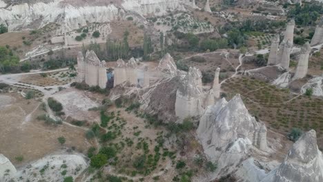 amazing cappadocia turkish goreme volcanic rock pillar town formations aerial left dolly high angle view