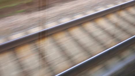 the railway line is moving fast the view from the traveling train 4k video