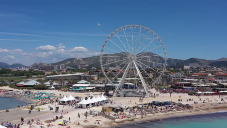 Aerial-back-traveling-Prado-beach-Borely-Marseille-amusement-park-France