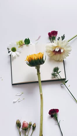 beautiful floral arrangement with open book