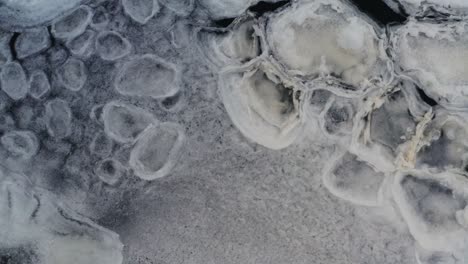 ice shapes float near frozen lake ice sheet cover, natural formation phenomena