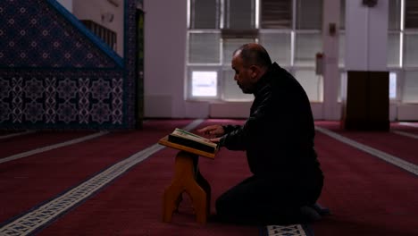 middle age man read quran mosque 1