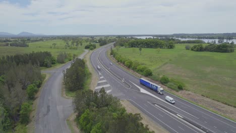 Cars-And-Trucks-Navigating-On-The-Road-In-Daytime