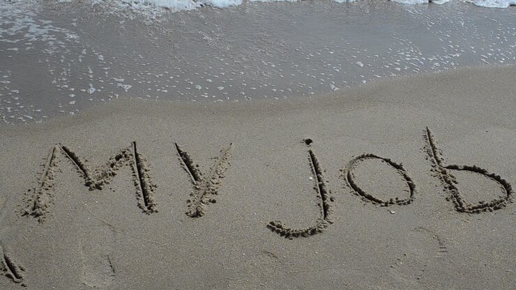 The inscription my job on sand. Shooting on the beach