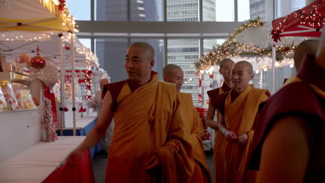 monks at an indoor market