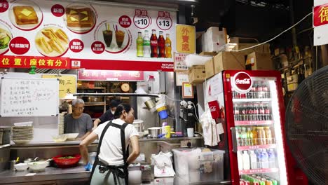 vibrant food stall with active staff in hong kong