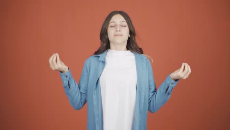 Young-woman-meditating-looking-at-camera.