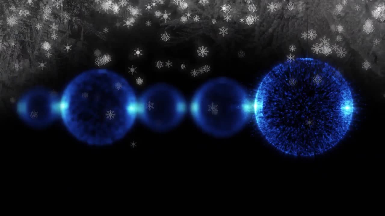 검은색 배경에 파란색 크리스마스 보블과 눈송이의 애니메이션