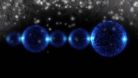 animación de bolas de navidad azules y copos de nieve sobre fondo negro