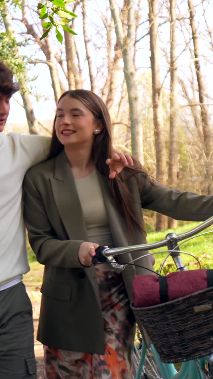 Couple enjoying a romantic bike ride in the park
