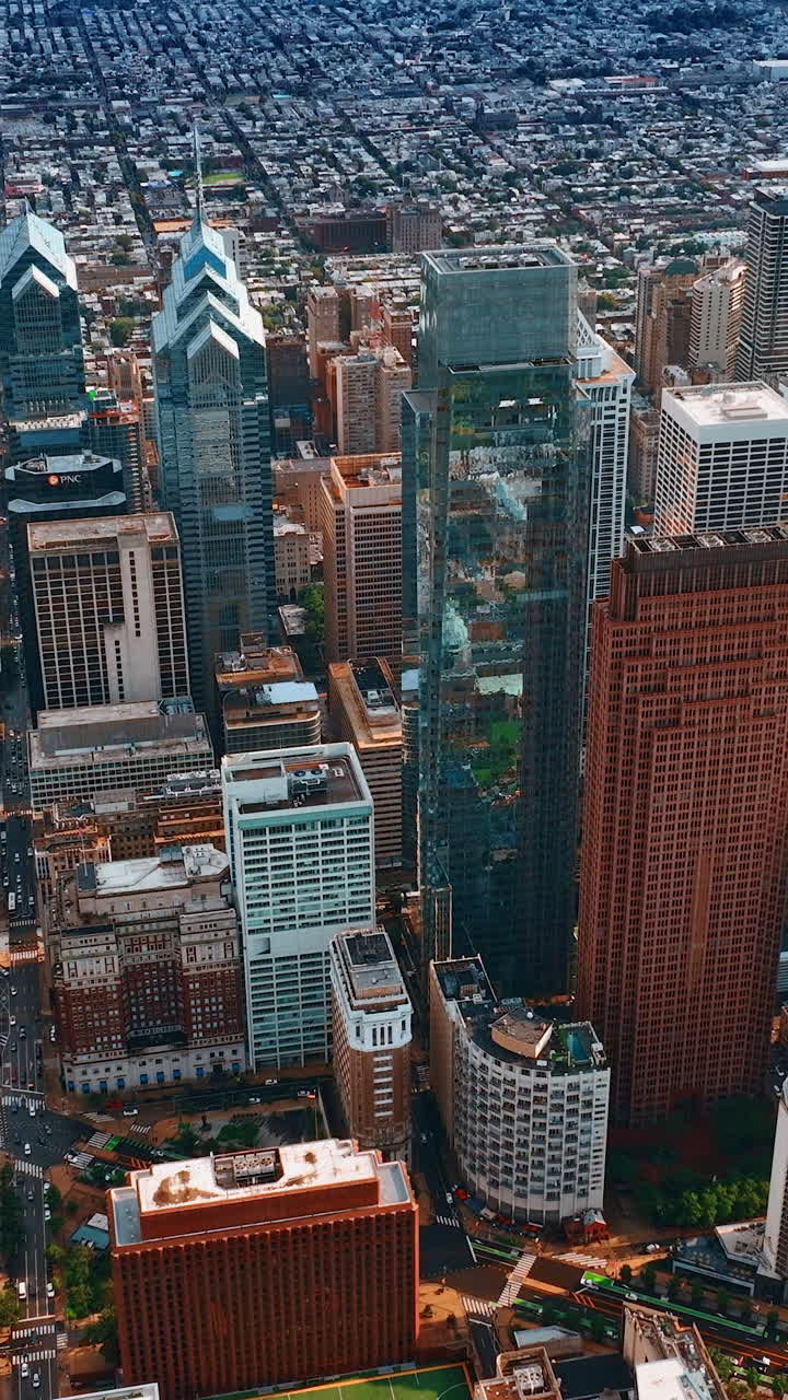 Impressive view of beautiful skyscrapers in the complex of Philadelphia downtown. Extensive panorama of the city from aerial perspective. Vertical video