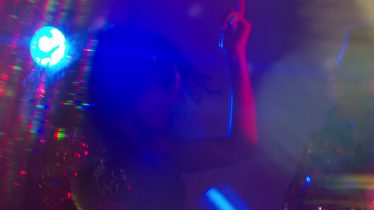 Close Up Of Two Women In Nightclub Bar Or Disco Dancing With Sparkling Lights 15