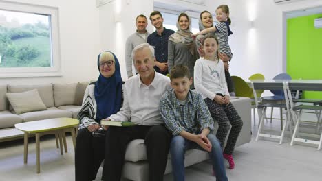 several generations portrait of happy modern muslim family before iftar dinner during ramadan feast at home