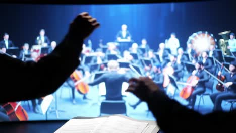 a conductor's passion: guiding a virtual orchestra through vibrant musical expressions captured in two dynamic frames of creative performance and artistic collaboration