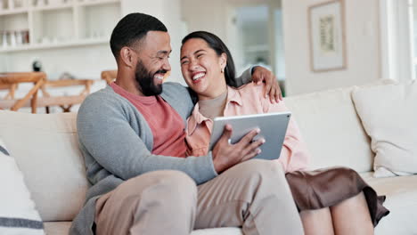Couple,-tablet-and-laugh-on-sofa-in-living-room