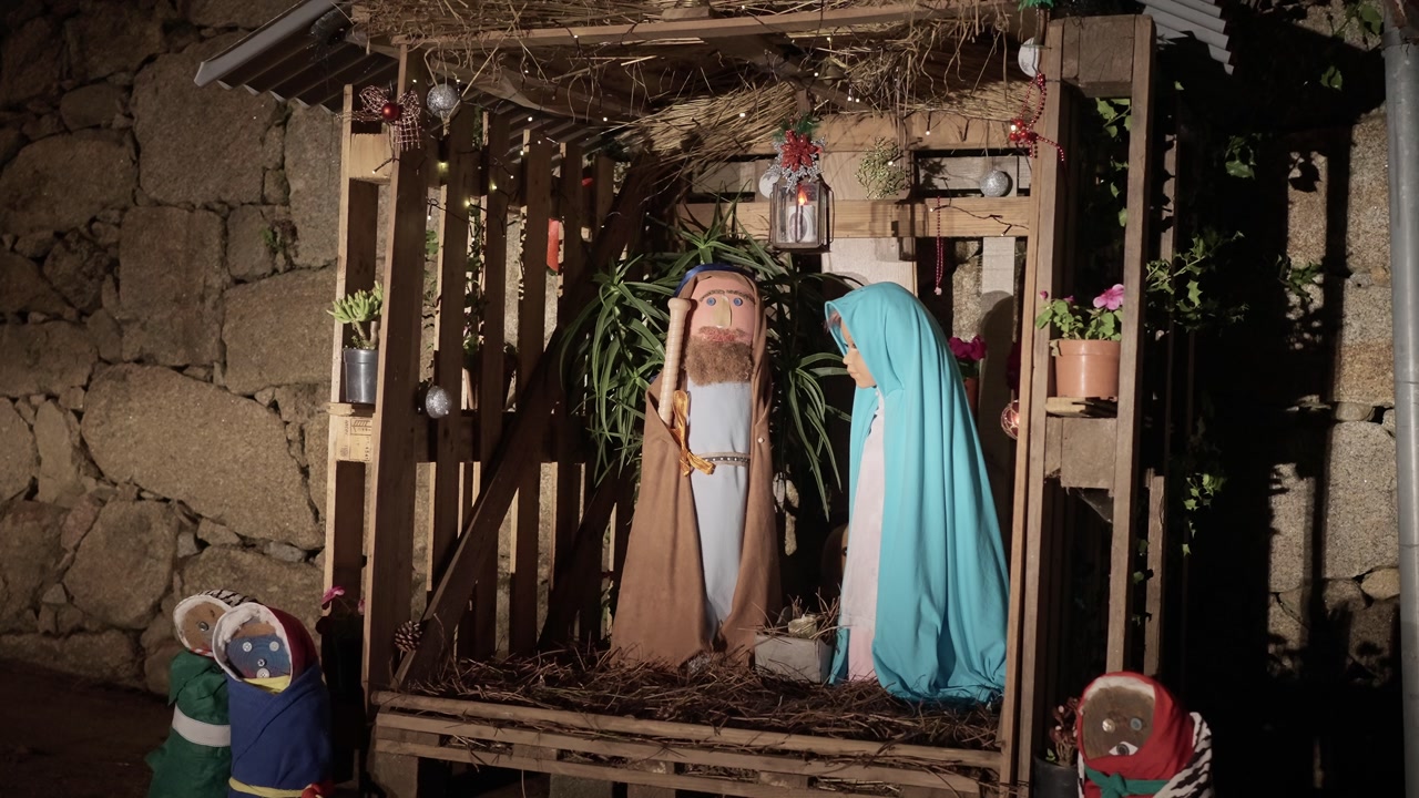 Outdoor nativity stable with wooden figures of Mary and Joseph