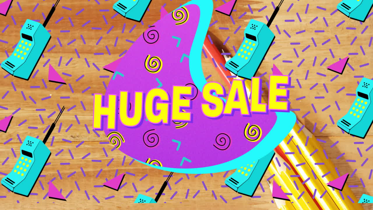 Huge sale graphic floating over wood tabletop, featuring bold yellow text, spirals, pencils