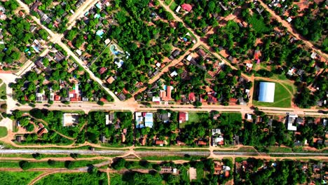 Drone-offers-a-top-down-view-of-El-Carmen-Rivero-Torres,-a-quaint-Bolivian-city,-capturing-its-entirety