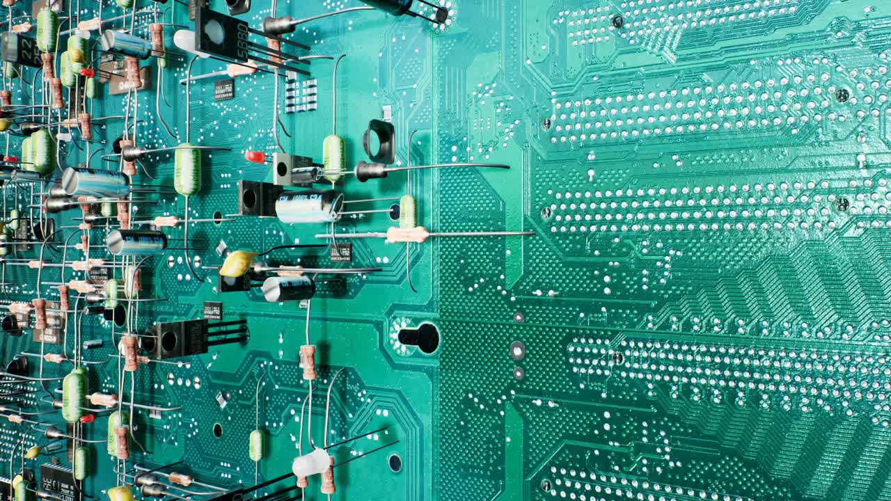 Looped technological background of the circuit board. Inside the electronic device are the components of the motherboard: microcircuits, transistors, LEDs, semiconductors. Seamless looping animation.