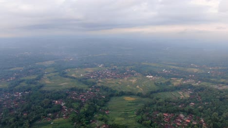 many small villages in vast landscape of central java, aerial view