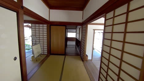 steadicam shot moving through hallway of a japanese house into kitchen and up to a mulberry paper window