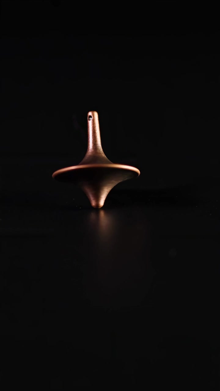 A spinning top gradually loses balance