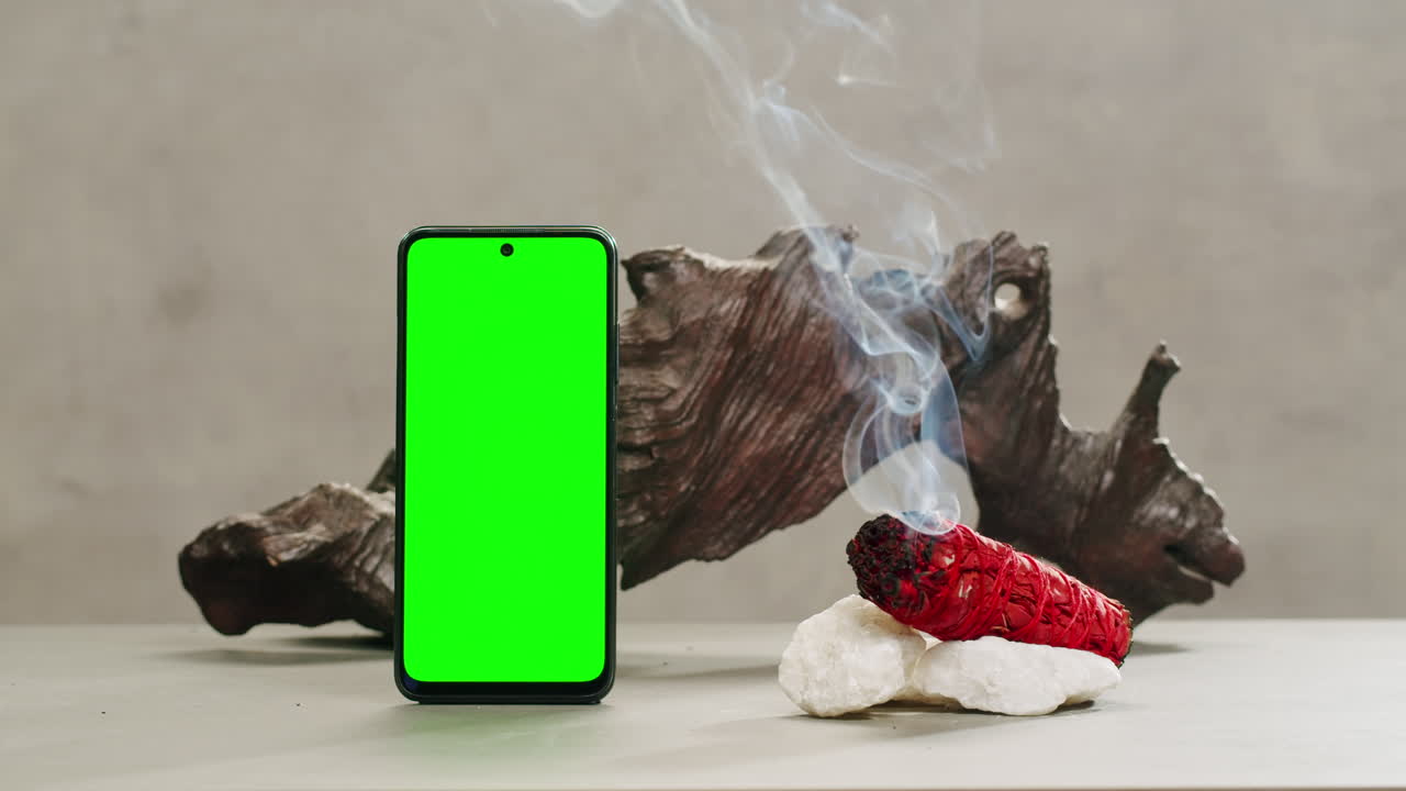 Person holding Palo Santo wood stick in hand, aromatic Palo Santo burning on black background, smoke spreading around, slow motion video clip, high quality 4k close up footage. High quality 4k footage