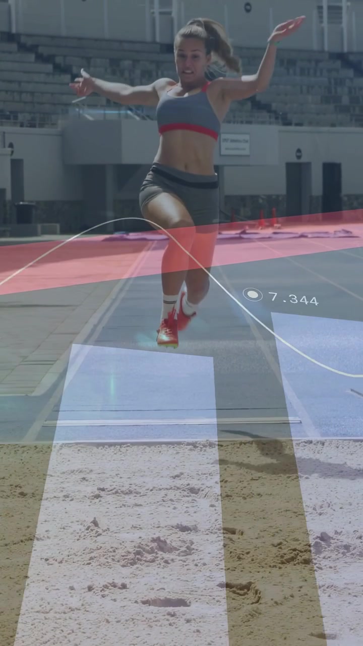 Vertical video: Woman runner running planting board jumping landing sand track metrics HUD updating
