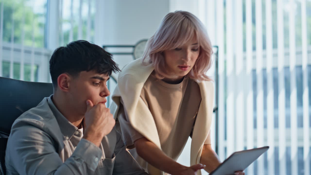 Couple managers analyzing office work closeup. Business colleagues brainstorming