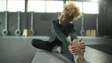 woman stretching in the gym
