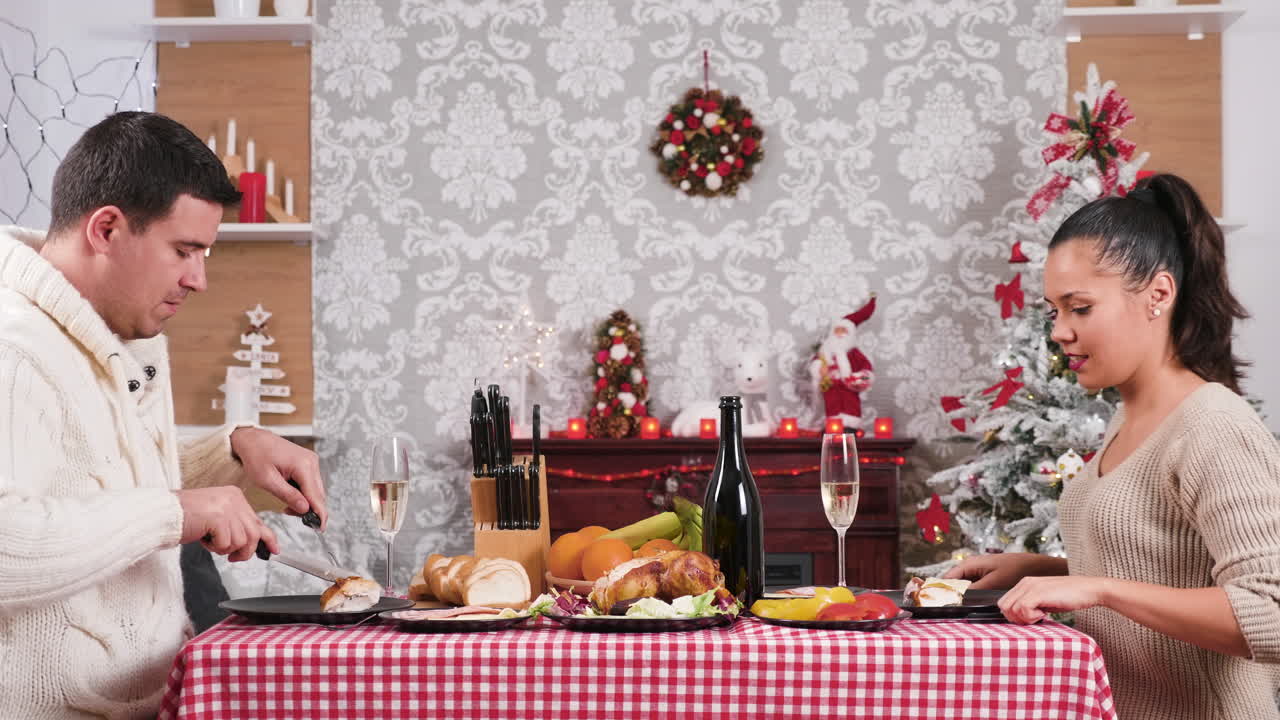 Couple celebrating Christmas with a romantic dinner