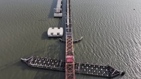 train passing over the old river draw bridge in perth amboy, new jersey