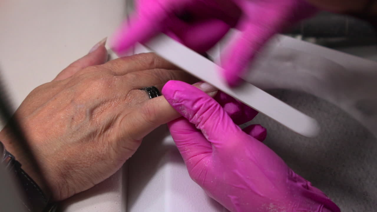 Manicure process with nail filing