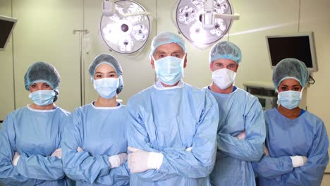 surgical team looking at the camera in operating theater