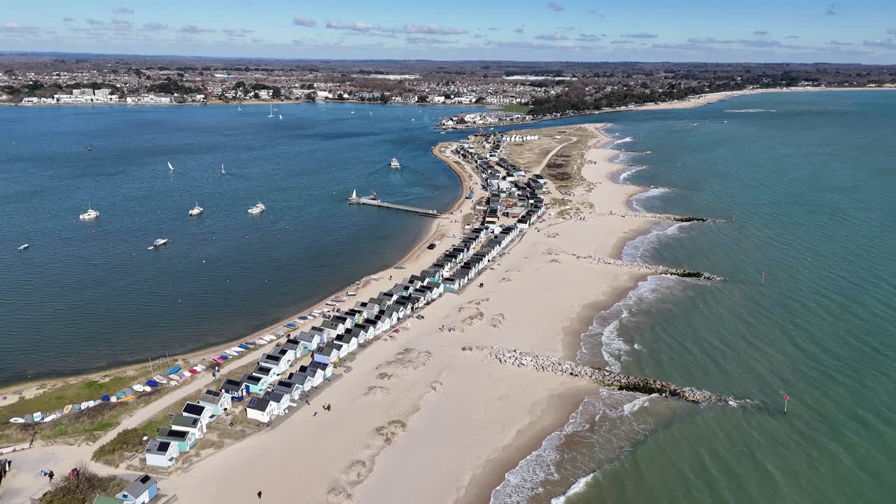 Beach huts Mudeford Sandbank Christchurch UK high angle aerial panning view
