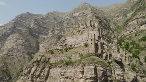 ancient cliffside village ruins in the mountains