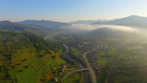 aerial view: beautiful canyon village located along the river 05